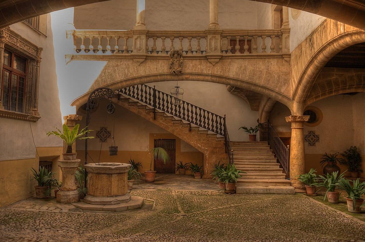 Inner courtyard of a historic house in Palma de Mallorca, showcasing the beauty of traditional architecture