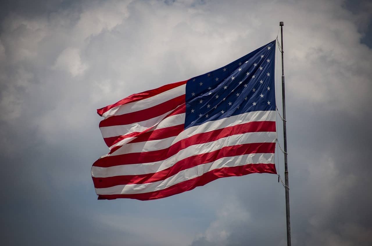 Flag of the United States waving against the sky